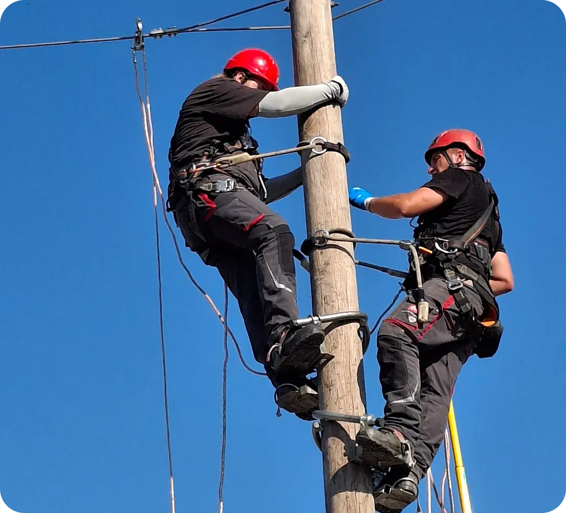 People work on the pole
