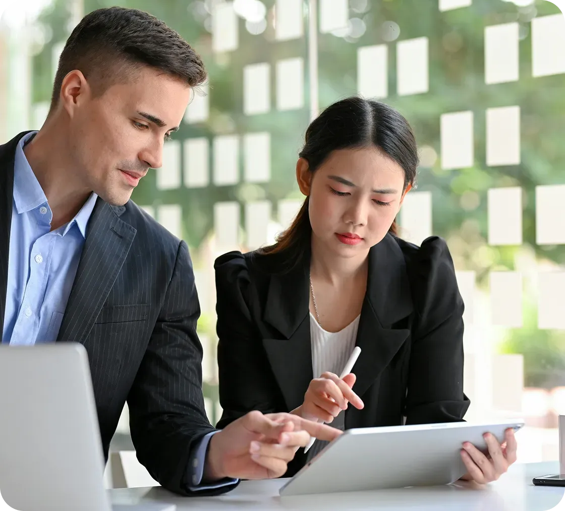 Workers in office looking tablet