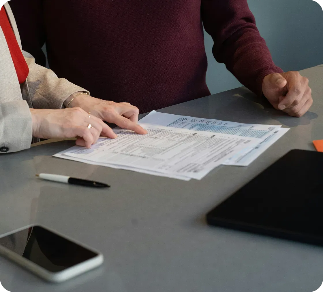Worker pointing on papers